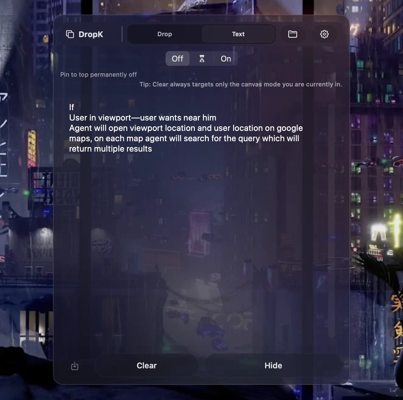 DropK text canvas in a dark translucent panel against a rainy city backdrop.